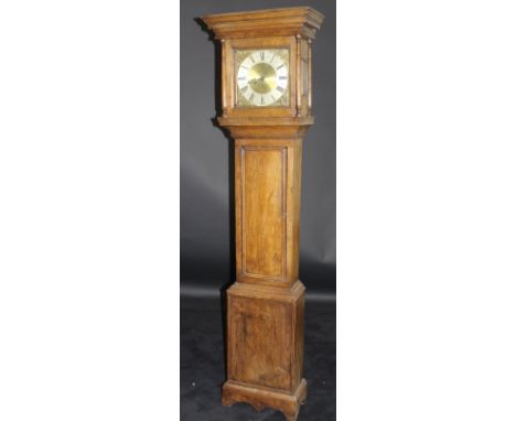 An 18th Century oak cased long case clock with moulded pediment above the thirty hour movement with square brass dial and sil