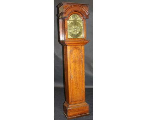 A mid 18th Century oak cased long case clock with 8-day movement, the arched hood above the brass dial with arch featuring a 