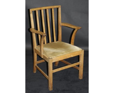 A Castle Bros oak stick back carver chair, bears impressed  mark "Castle Bros" with a burnt crown above the initials "W.D" be