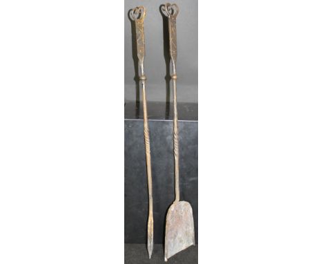 Two fireside tools, comprising a poker and a shovel, in the manner Ernest Gimson, each with a flattened handle with scrolling