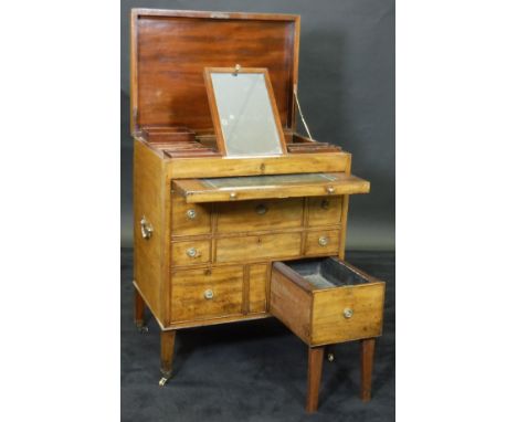 A 19th Century mahogany Rudd style dressing table, the rising lid opening to reveal a fitted interior comprising easel mirror