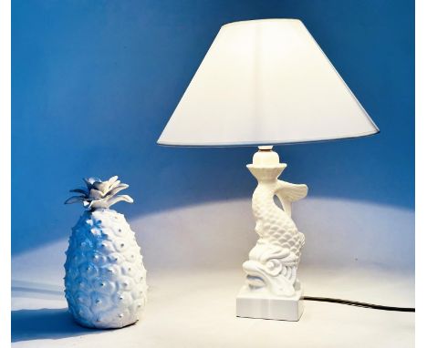CASA PUPO LAMP, Portuguese white ceramic in the form of a dolphin together with a Portuguese model of a pineapple, 47cm H. (2