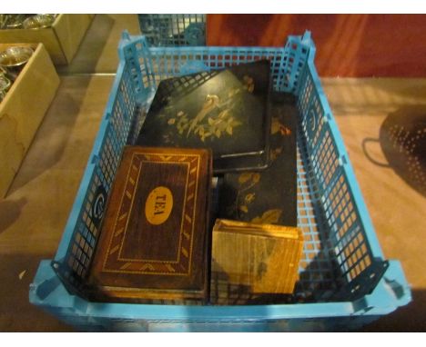 Two Papier-maché dressing table boxes with contents including cloths, photographic cards, hat pins and perfume bottles, tea c