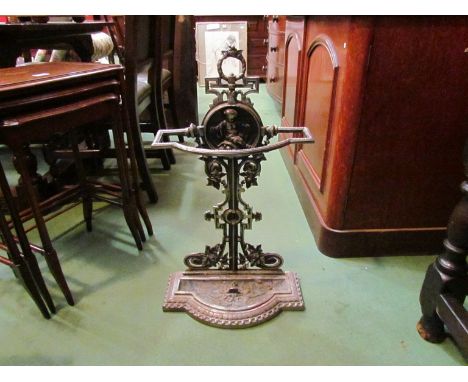 A 20th Century Victorian style cast metal hall umbrella and stick stand with putto design relief