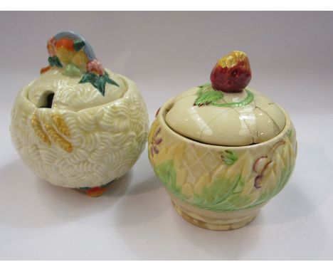 Two Clarice Cliff for Newport preserve pots, one lid repaired