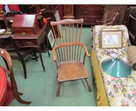 A 19th Century elm stick back elbow chair