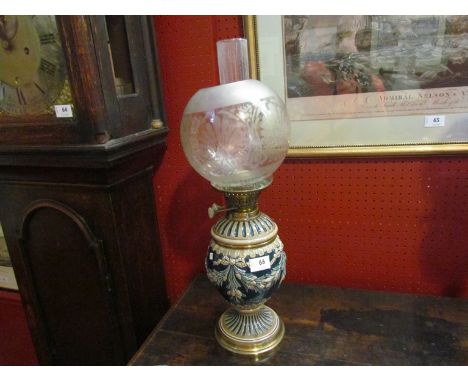 A Victorian stoneware oil lamp and shade, 57cm high
