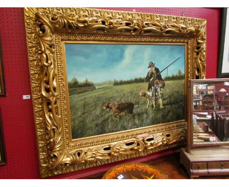 A large gilt framed print and oil on canvas depicting hunstman smoking pipe with hounds in grassy field, unsigned, 60cm x 90c