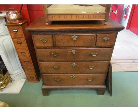 A Georgian oak and crossbanded chest of six drawers on bracket feet, 108cm high
