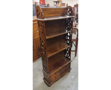 A Chippendale style hardwood open bookcase 