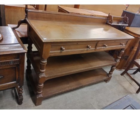 A late Victorian Liberty &amp; Co oak three tier buffet sideboard 