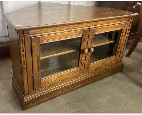 An Ercol Golden Dawn elm corner TV/media unit