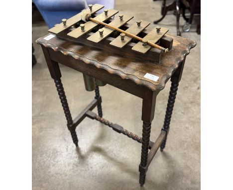 An early 20th Century oak bobbin turned occasional/xylophone table 