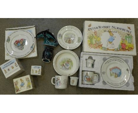 Wedgwood Peter Rabbit china, some boxed and a Poole Dolphin