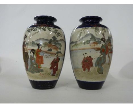 Pair of Japanese Satsuma ware vases, the blue ground with panels of Japanese figures in landscape with Mount Fuji in the back