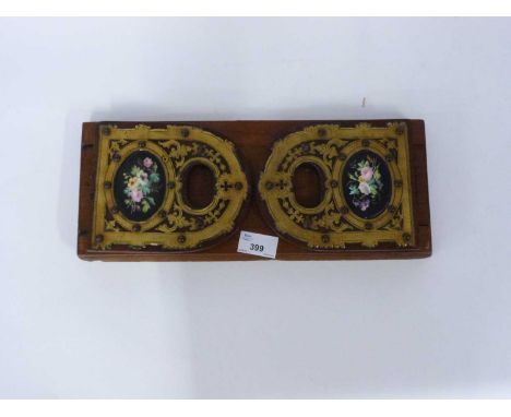 Wooden book ends, each end with a inlaid panel of painted flowers, 35cm long