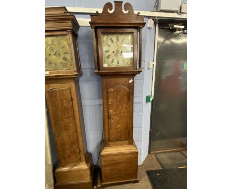 Georgian long case clock with unsigned floral painted dial, with an eight day movement, set in a oak case with arched pedimen