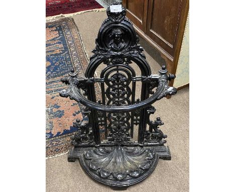 Victorian cast iron umbrella and stick stand of bow front form set with a removeable drip tray, 85cm high