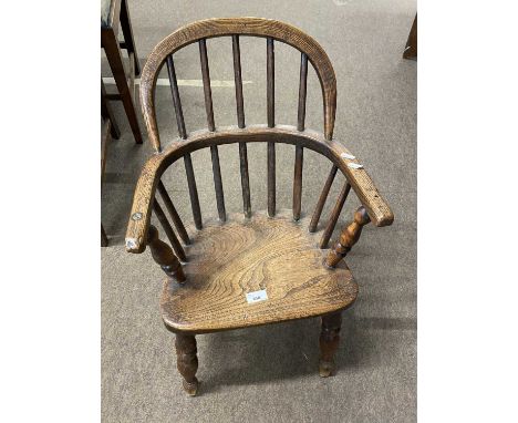 Small 19th Century elm seated child's Windsor type chair with hooped stick back and turned legs, 62cm high