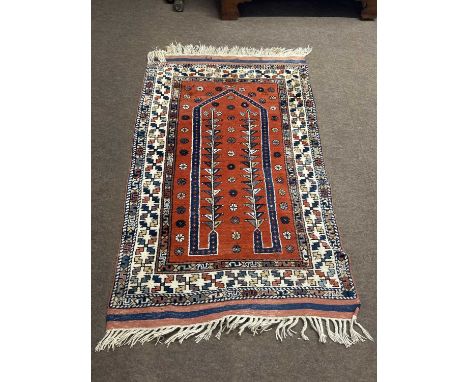 Modern Middle Eastern wool floor rug decorated with a large central red panel surrounded by a geometric border, 145 x 92cm