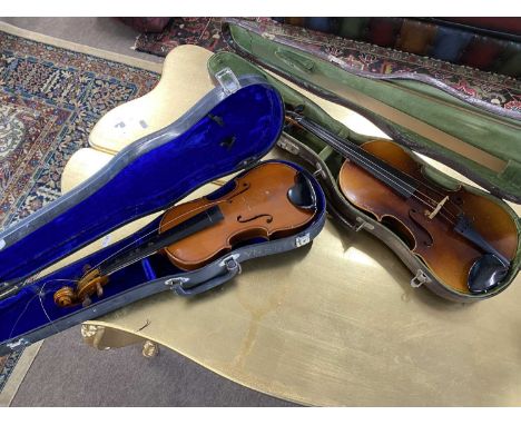 Violin bearing a spurious Stradivarius label contained in a mock snake skin case plus one other (2)