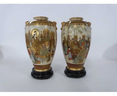 Pair of Japanese Satsuma ware vases of lobed form, decorated with Japanese figures and Mount Fuji in the background with Kyli