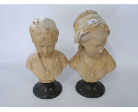 Pair of ceramic busts of children on black circular bases, 42cm high