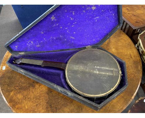 Large vintage banjo bearing makers mark Spratt, The Strand, 87cm high and 40cm wide together with a accompanying wooden carry