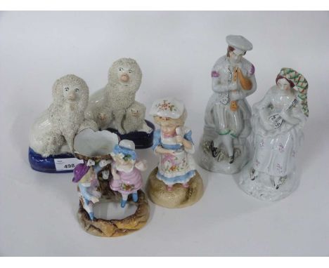 Group of English continental porcelain figures including a pair of Staffordshire figures, a pair of continental porcelain spi