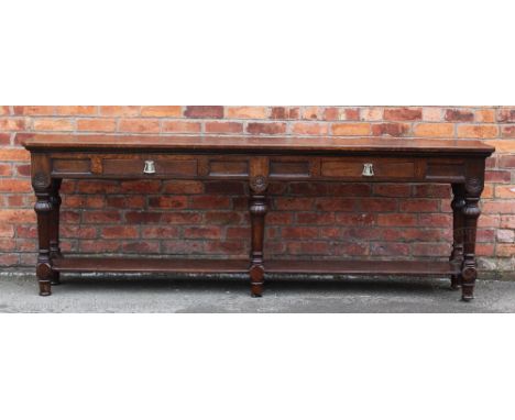 A Victorian oak hall / serving table, with two frieze drawers above pot shelf on turned and block legs, 83cm H x 244cm W x 39