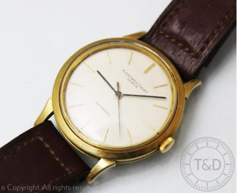 An Audemars Piguet Automatic 18ct yellow gold wristwatch, the circular case enclosing champagne coloured circular dial and gi