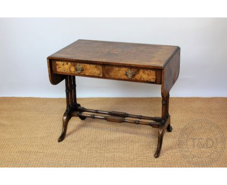 A reproduction walnut sofa table, with two drawers, on standard end supports, 74cm H x 89cm W x 56cm D