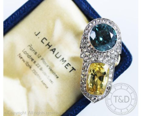 A Chaumet Art Deco dress clip circa 1935, of Odeonesque design, set with a circular blue zircon above a rounded rectangular, 