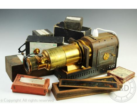 An Atent No.2459 lacquered brass and tinplate magic lantern, the projector with a telescopic lens, 56cm long with a quantity 