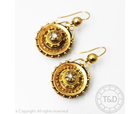 A pair of Victorian diamond set drop earrings, 19th century, each of target form and set with a central old cut diamond withi