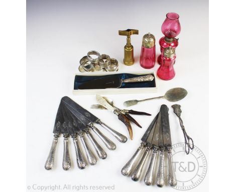 A selection of silver, plated wares and cranberry glass, to include; four silver napkin rings, gross weight 103.9gms, along w