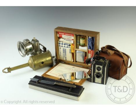 A selection of vintage items to include a Joseph Lucas Ltd 'Oalcia Club' carbide bicycle lamp, 17cm high, a Sanoid First Aid 