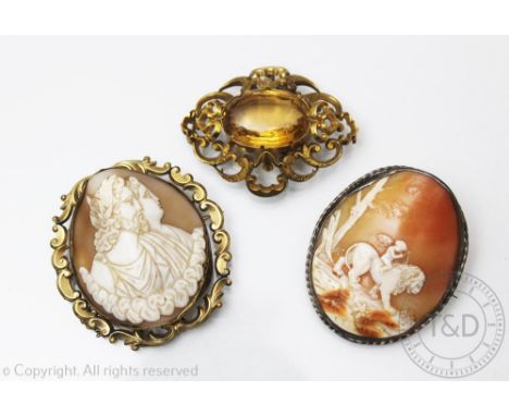 Three brooches, to include; a carved shell cameo brooch depicting classical figures, within yellow metal scroll surround 6cm 