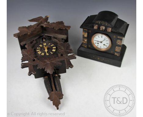 A Victorian marble eight day mantle clock, with Roman numeral dial and movement striking on a gong, 26.5cm, with a carved and