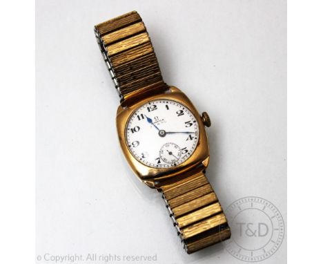 A 9ct gold Omega wristwatch Birmingham 1930, the cushion shaped case enclosing a circular white enamel dial marked 'Omega G H