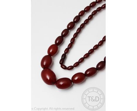 A 'cherry' amber bead necklace, the graduated beads with screw clasp, gross weight gross weight 81.6gms  CONDITION REPORT: Sm