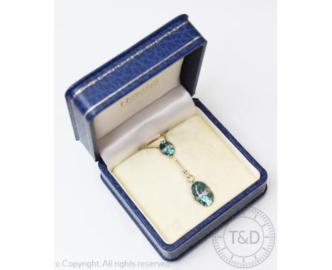 A zircon set pendant, early 20th century, designed as a oval, mixed cut zircon (measuring approx 10.5mm x 8.5mm) suspending a