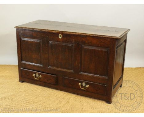 An 18th century oak mule chest, with hinged top above two drawers stile feet. 74cm H x 128cm W x 54cm D   CONDITION REPORT:  