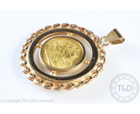 A George V gold sovereign dated 1925, within yellow metal pendant surround stamped '750', gross weight 15.2gms 