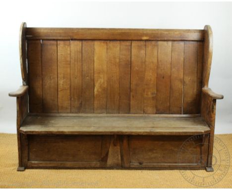 An 18th century style oak wingback settle, with panelled back on standard end supports 125cm H x 184cm W x 50cm D   CONDITION
