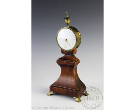 A 19th century mantel clock, possibly French, with circular white enamel face and black Arabic dial within brass case surmoun