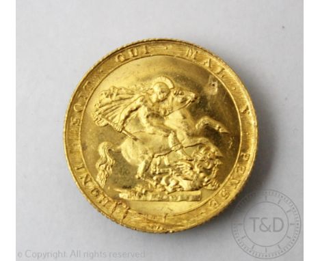 A George III gold sovereign dated 1820, weight 8gms   CONDITION REPORT:  There is a small scratched patch at about 2'oclock o