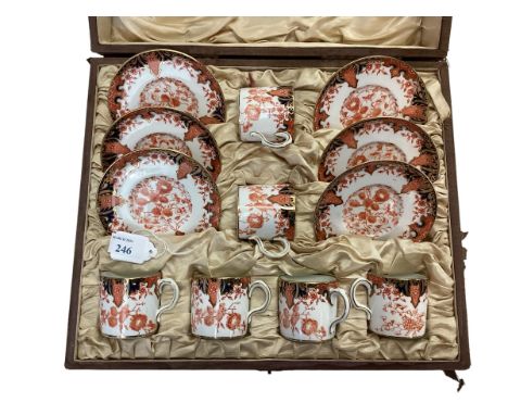 A cased set of Royal Crown Derby, 6 set coffee cans and saucers, cracks to base of one coffee can/.&nbsp; Wear to box