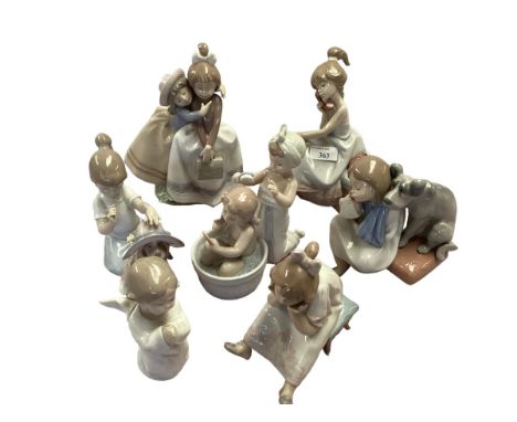 A collection of seven Lladro figures. 