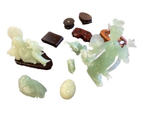 A collection of (6) Jade style glass oriental carved ornaments, some with hardwood stands 